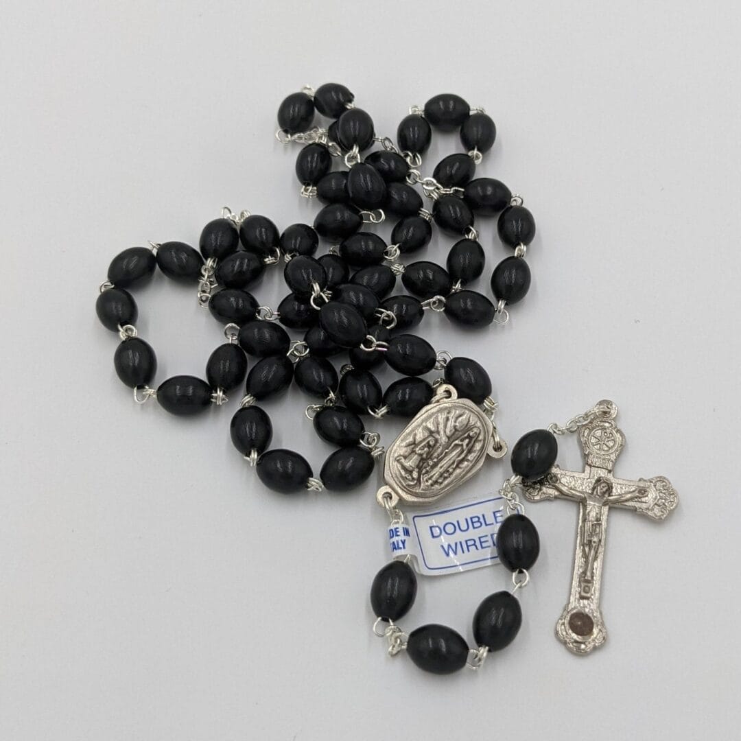 ROSARY BEADS - SMOOTH BLACK BEADS WITH LOURDES WATER